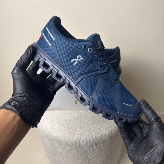 On Cloud 6 in a navy and black